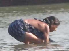 Indian women bathin in orissa village